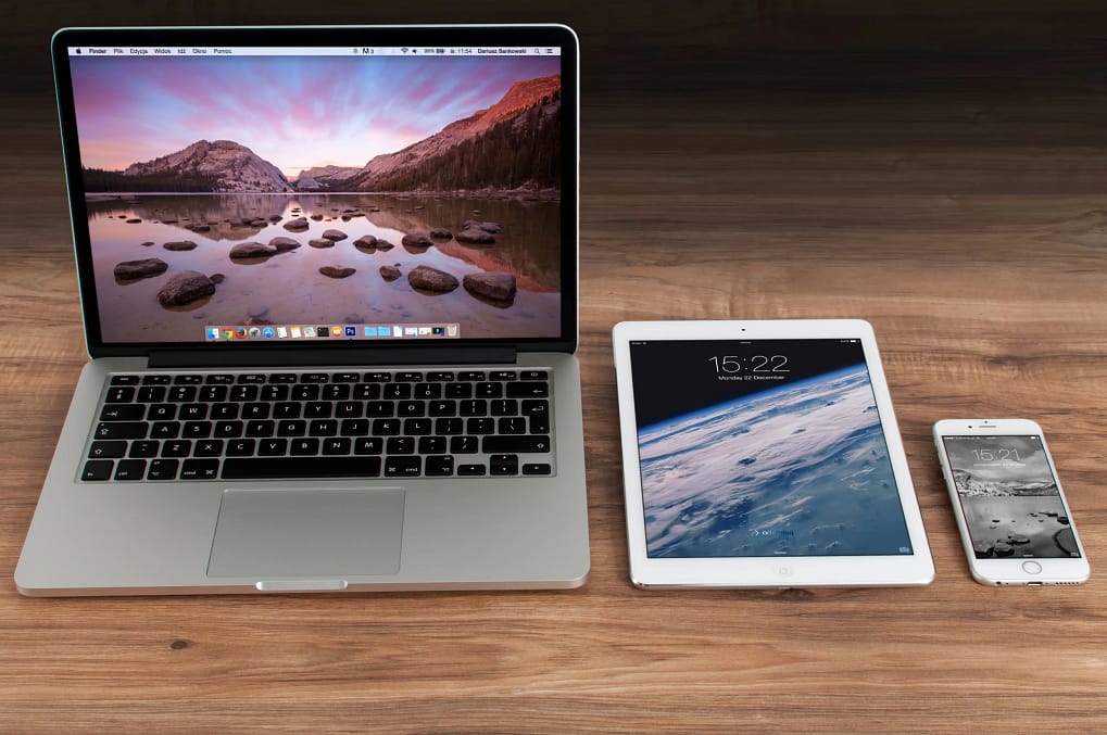 a photo of a laptop, tablet, and phone side by side, showcasing the different devices social media users use