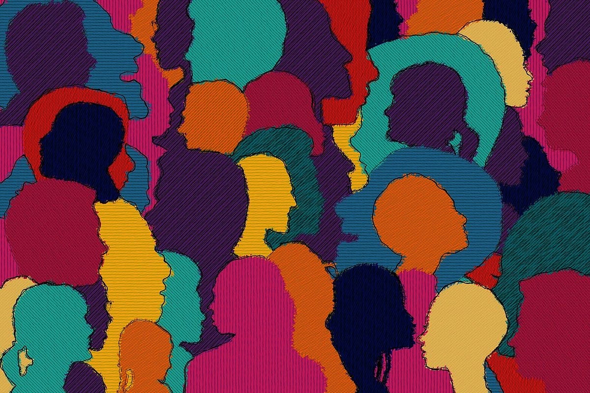 a diverse outline of people's profiles with various sizes, colors, and shapes, highlighting the renewed perspective of workplace diversity gained from the disc assessment