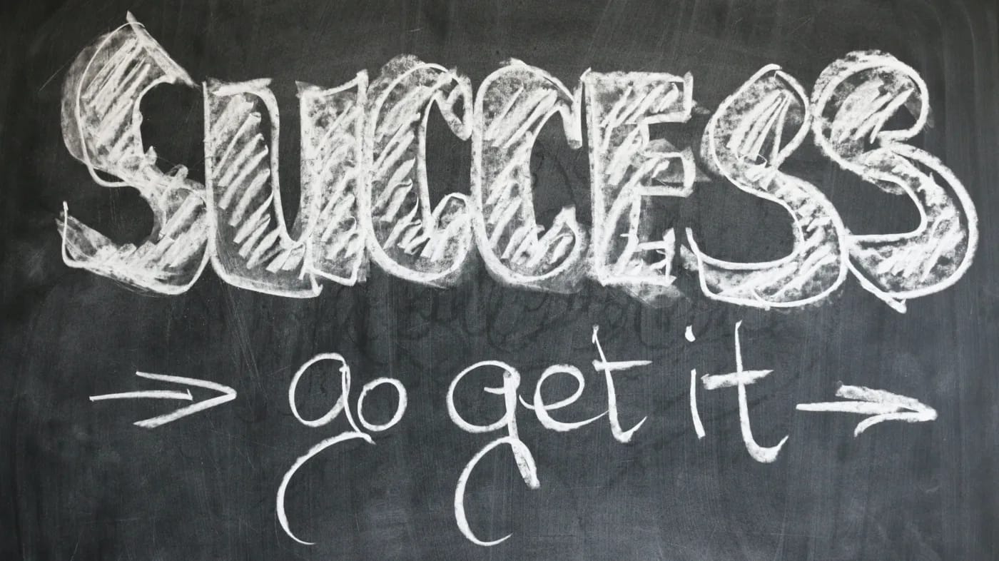 chalkboard writing that says "success: go get it"