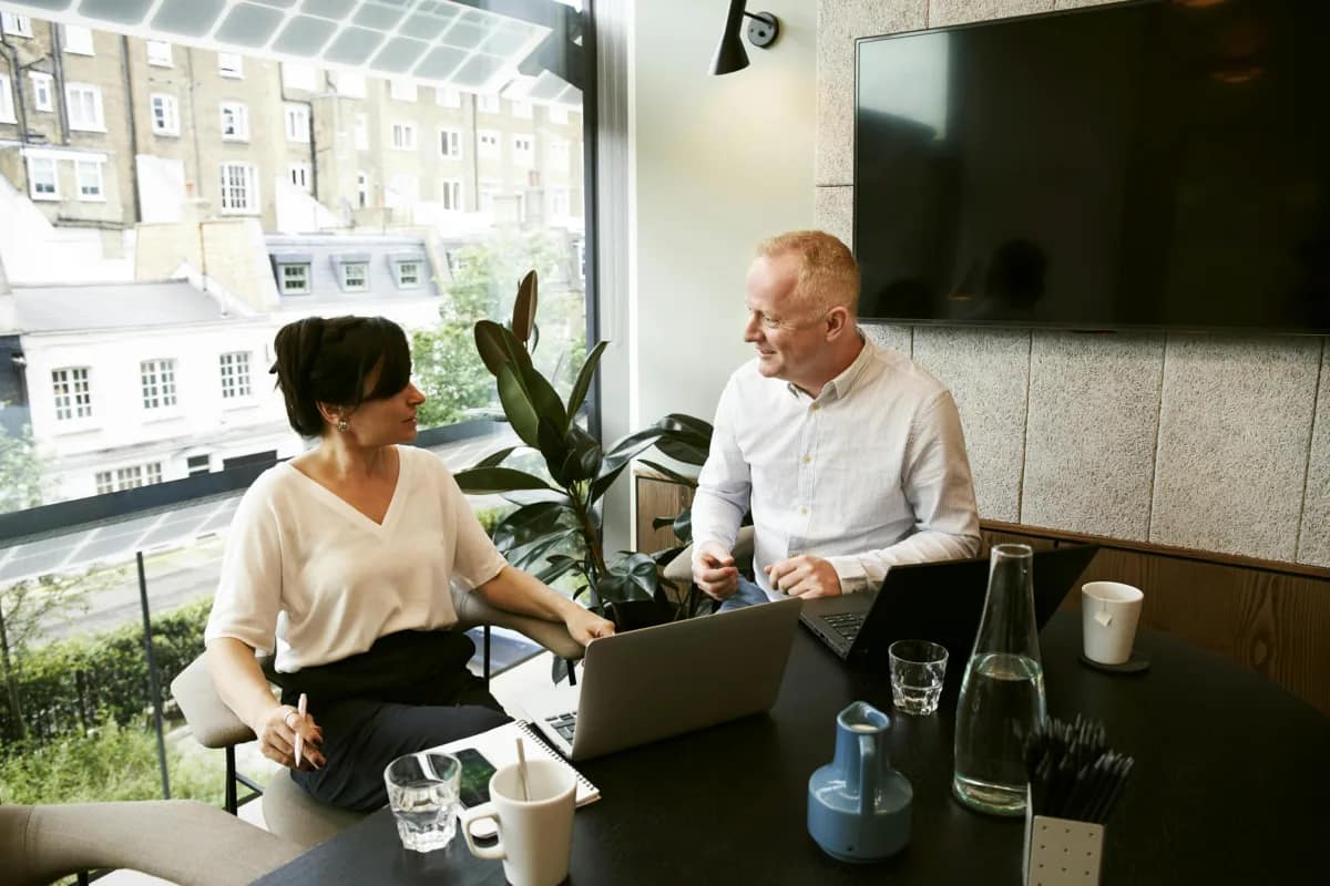 two executives discussing employee evaluation