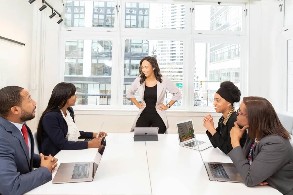 a room of people going through employee performance review