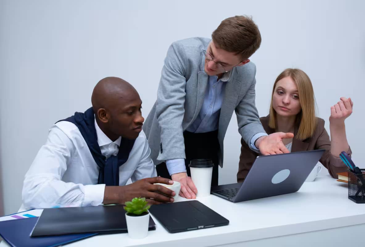 business executives discussing how to resolve their business mistakes