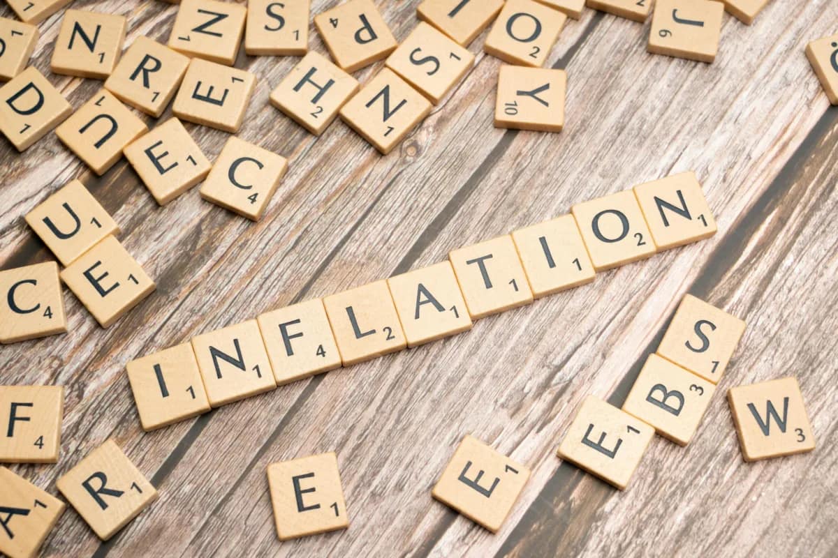 scrabble tiles spelling out the word "inflation"